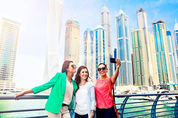 Three women take selfie in Dubai Marina. Shot from Istockalypse Dubai 2015.